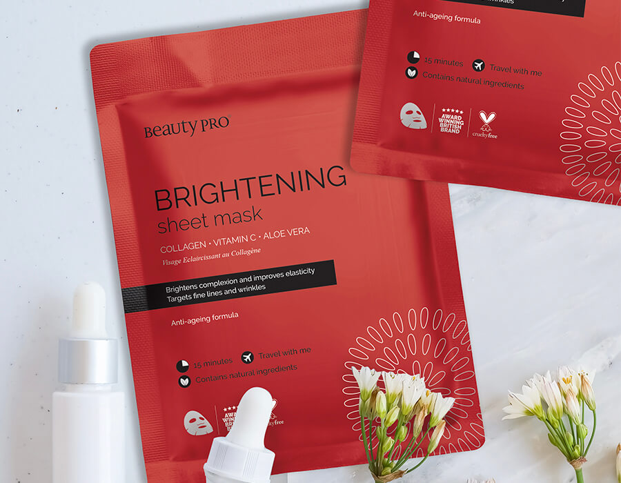 Brightening mask packaging on a white background with sprigs of flowers and serum bottles overlaid