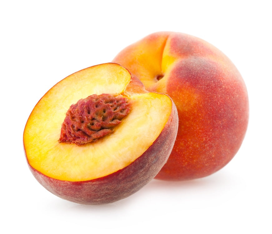Peach and half of a peach on a white background